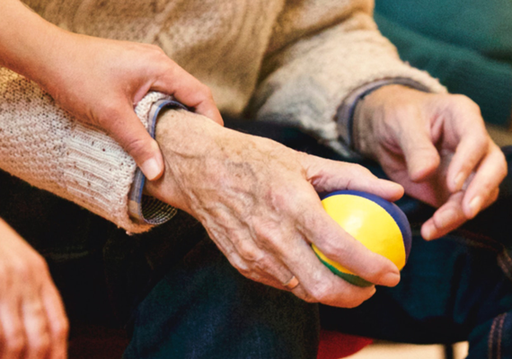 older hand with ball