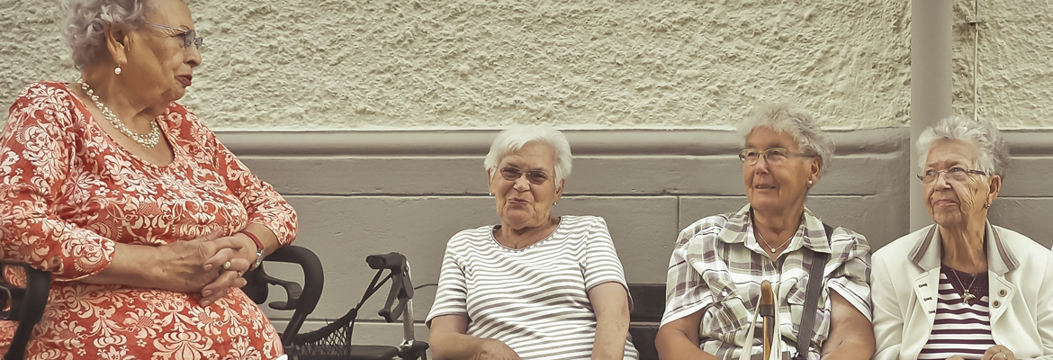 older women sitting on a bench